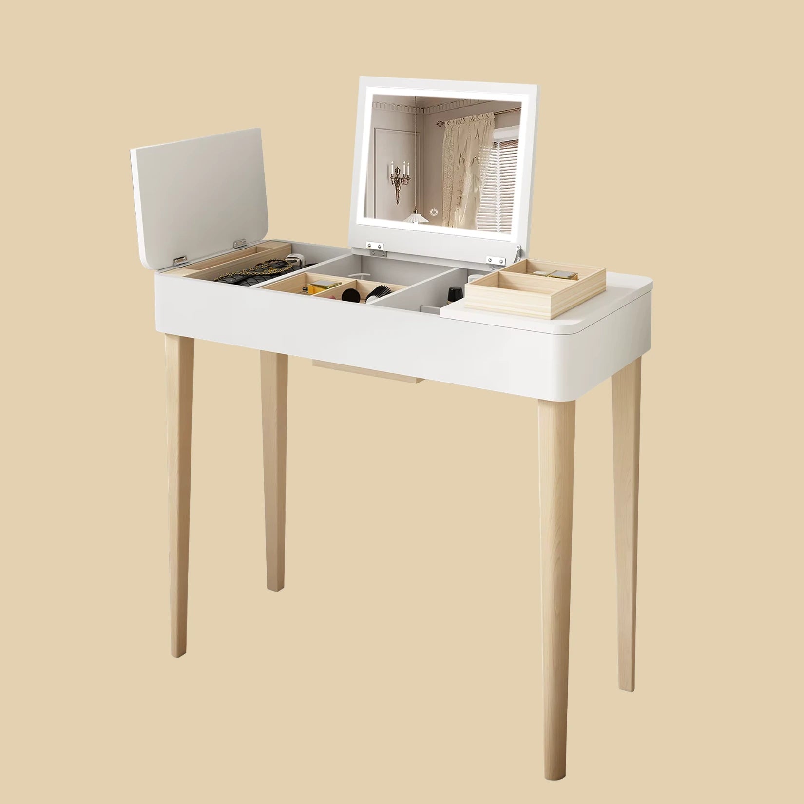 Coiffeuse avec miroir rabattable vue de dessus avec rangements ouverts.