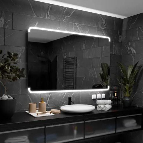Miroir éclairé salle de bain 180x80 allumé au-dessus d'une vasque ronde sur mur en ardoise noire.
