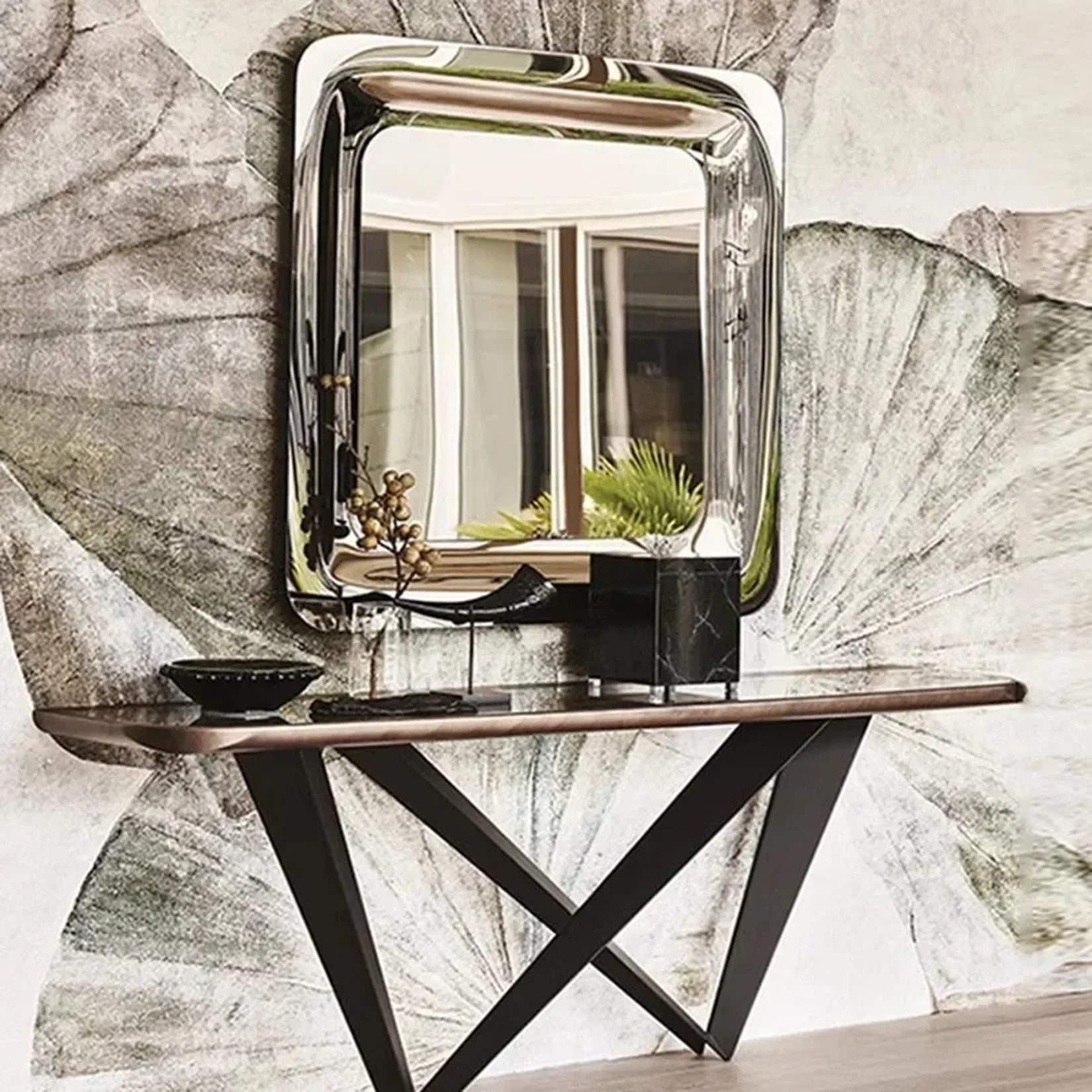 Miroir inox poli carré au-dessus d'une console design.