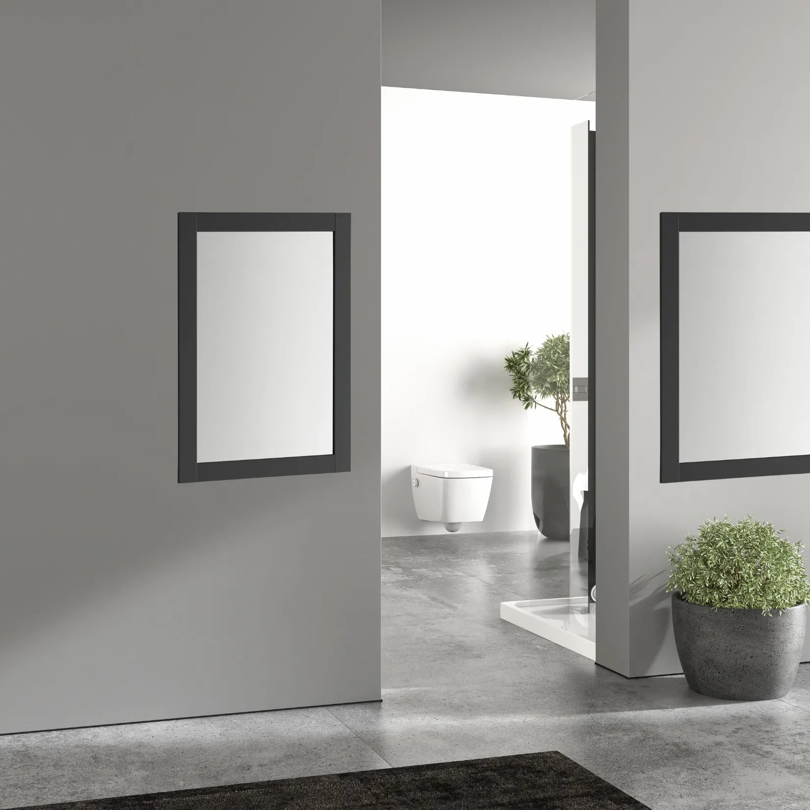 Miroir minimaliste noir sur mur gris dans un intérieur sobre et lumineux.