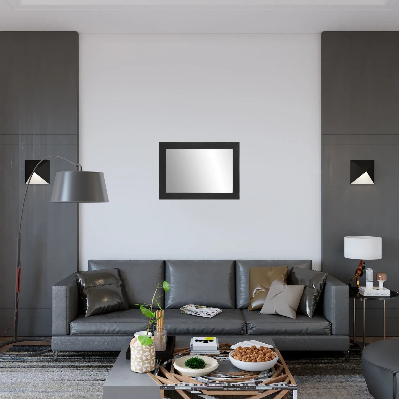 Miroir rectangulaire noir en bois sur mur blanc dans un salon élégant aux tons gris.