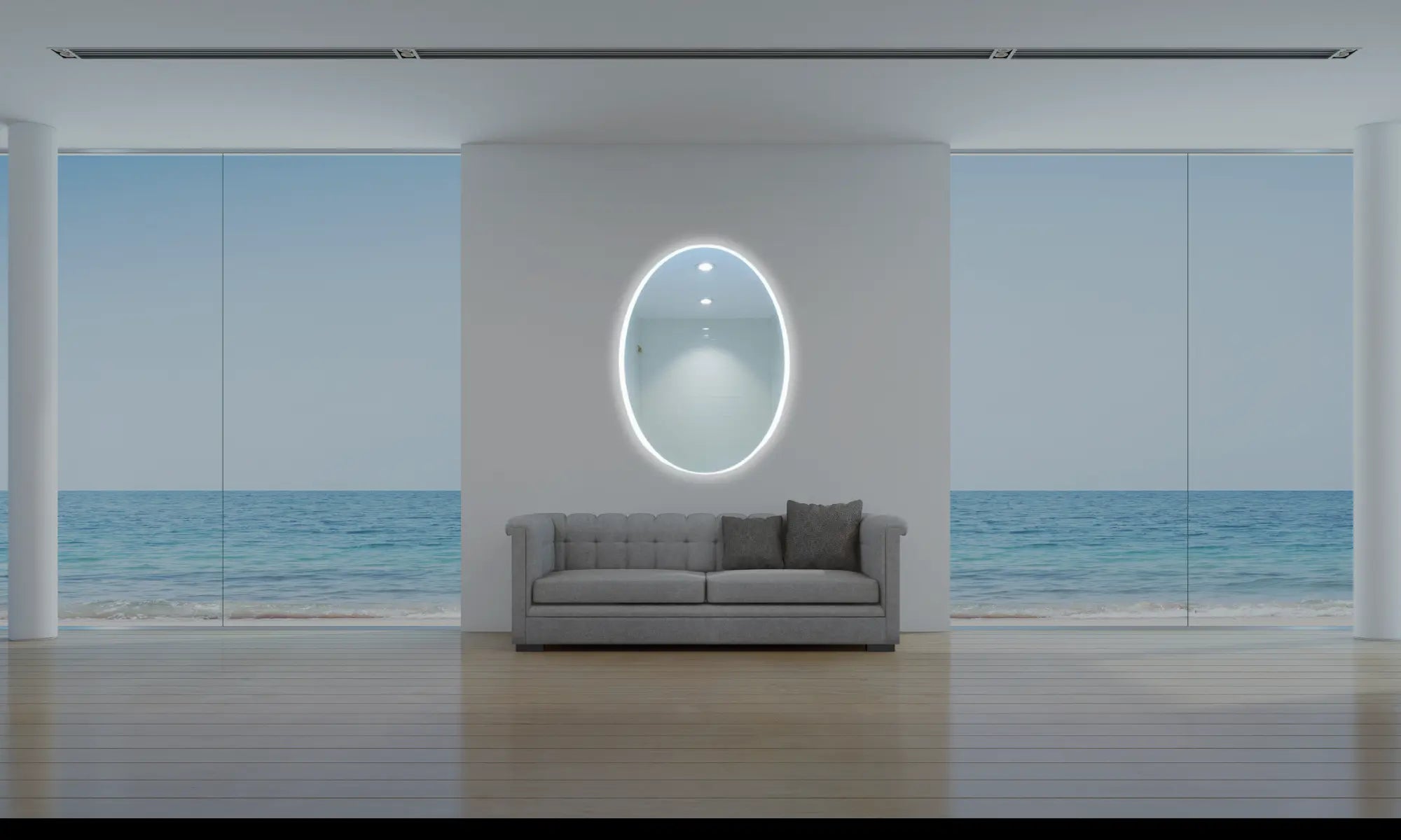 Salon avec vue sur mer au style rehaussé avec un miroir ovale lumineux.