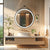 Miroir rond chauffant avec cadre en aluminium noir et éclairage LED, parfait pour une salle de bain moderne