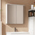 Armoire à miroir salle de bain fixée au mur au-dessus d’un lavabo.