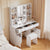 Rangement ouvert de la coiffeuse avec miroir LED rempli de maquillage et accessoires beauté.