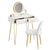 Packshot de la coiffeuse LED avec miroir, tiroirs ouverts et chaise en velours assortie.
