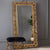 Grand miroir baroque de 180 cm avec cadre en bois orné et doré, parfait pour un intérieur classique.