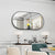 Grand miroir mural noir ovale en décoration murale d’une salle à manger contemporaine.