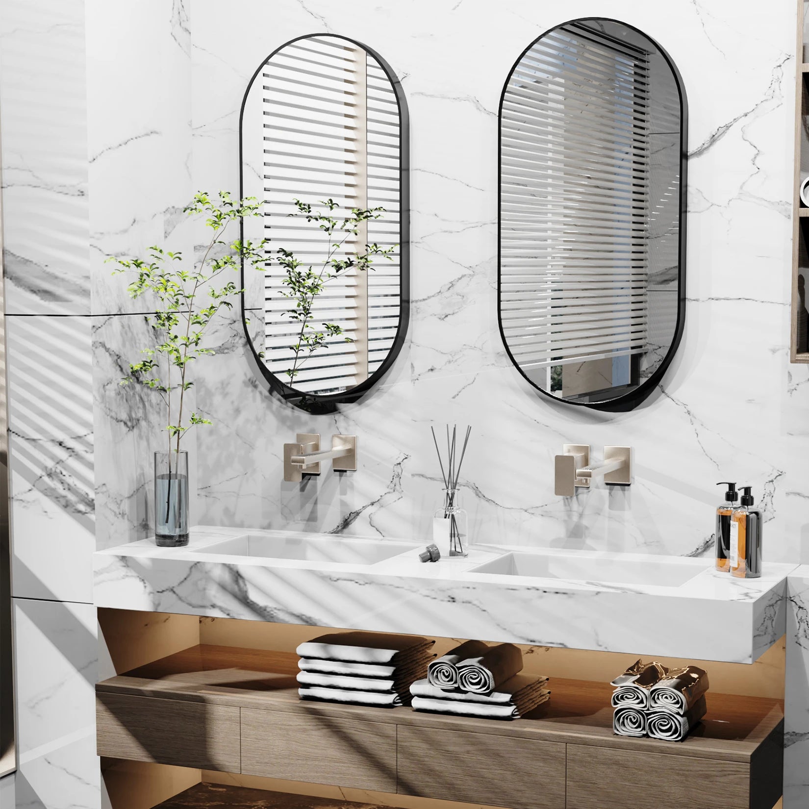 Grand miroir ovale noir installé dans une salle de bain moderne avec deux vasques.