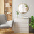 Grand Miroir Rond Doré dans un salon moderne avec décoration naturelle et lumineuse.