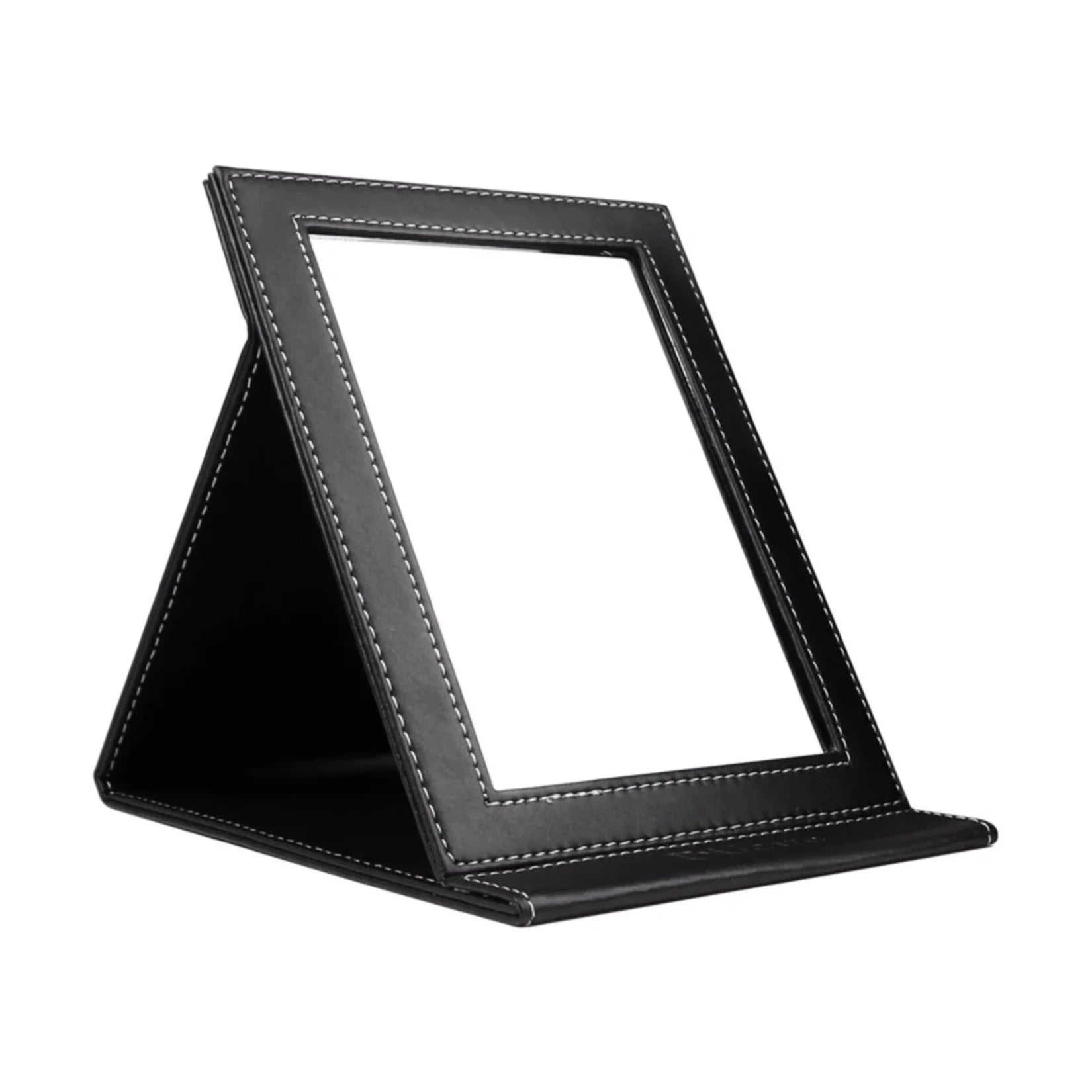 Miroir de poche cuir noir en position ouverte rigide sur une table.