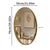 Miroir doré ovale accroché au mur dans une chambre chic et lumineuse.
