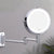 Miroir grossissant LED avec installation murale et bras articulé pratique.