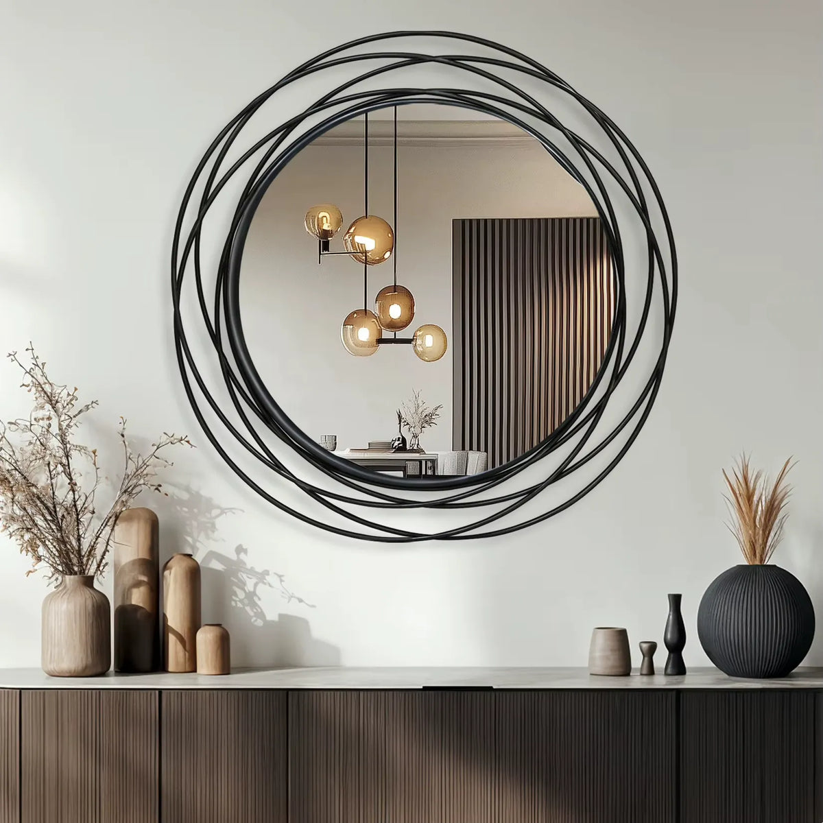 Miroir industriel rond au-dessus d’un buffet de salon, cadre en spirale de fil de fer noir.