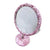 Miroir de maquillage orné de strass roses clairs scintillants pour une coiffeuse élégante.