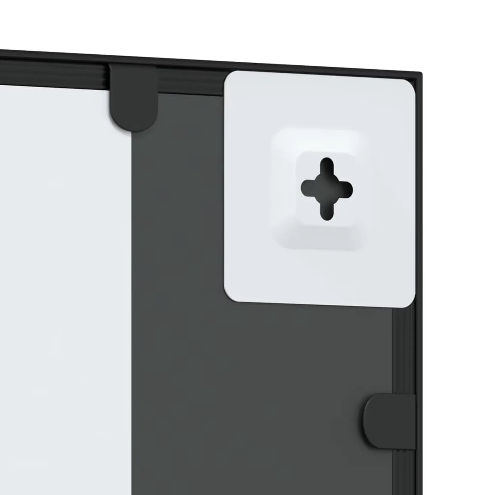 Détail fixation murale miroir métal noir industriel – pattes de visserie.