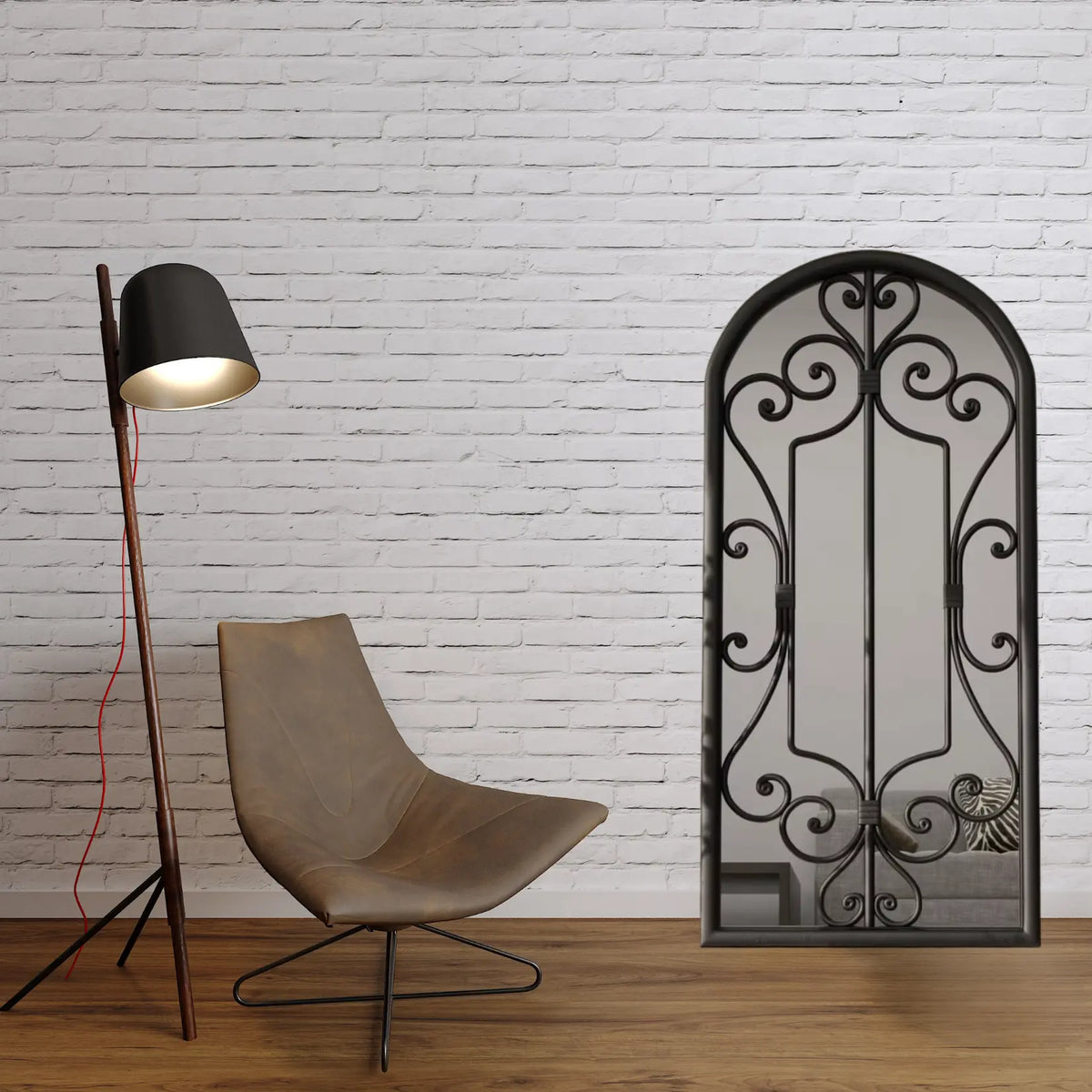 Miroir noir rectangulaire mural dans un intérieur style loft avec mur en briques blanches.