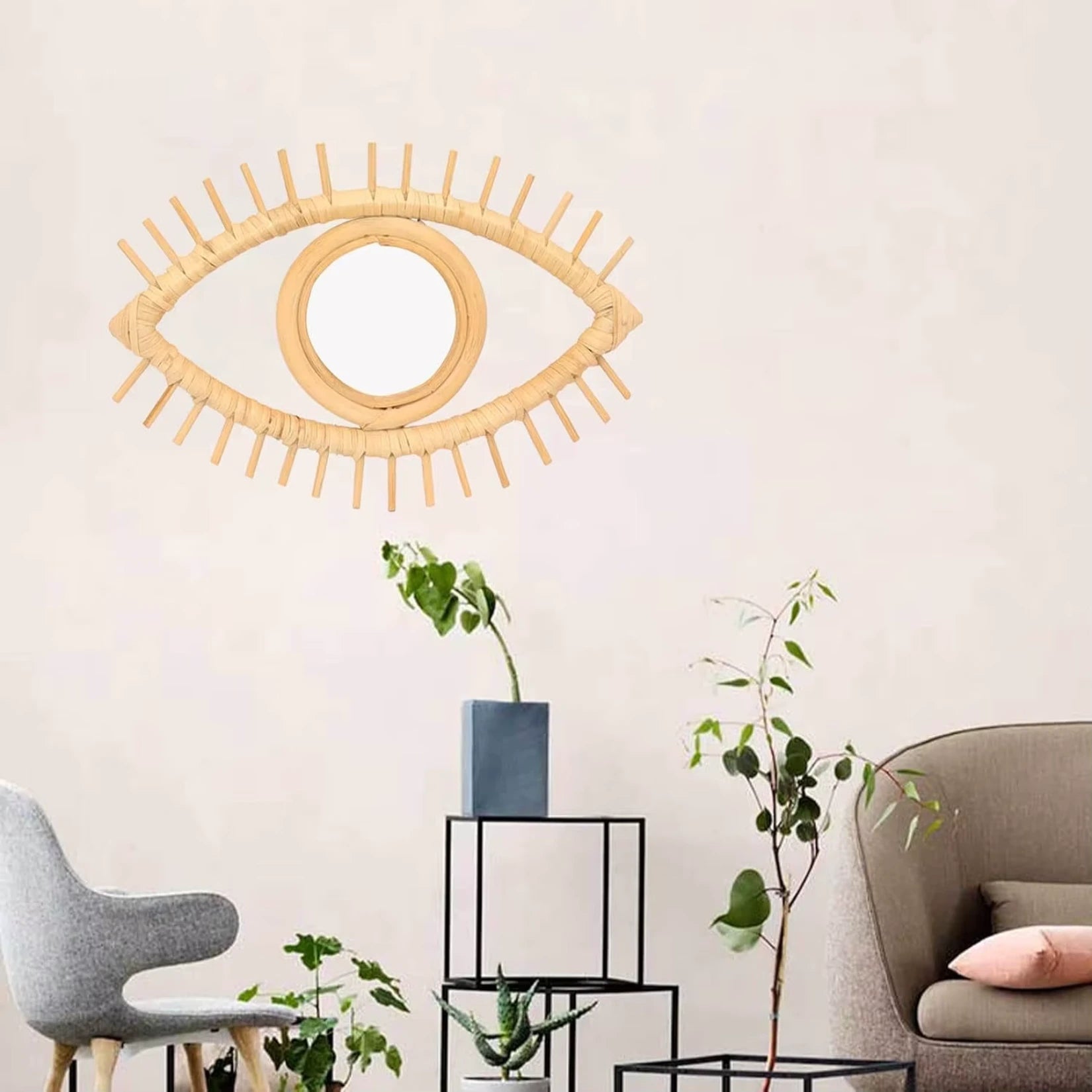 Miroir œil en rotin pour une décoration murale élégante.