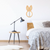 Miroir oreille lapin en rotin, idéal pour une décoration murale originale.