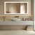 Miroir Petite Salle de Bain 80x60 fixé au mur avec éclairage LED et cadre doré.