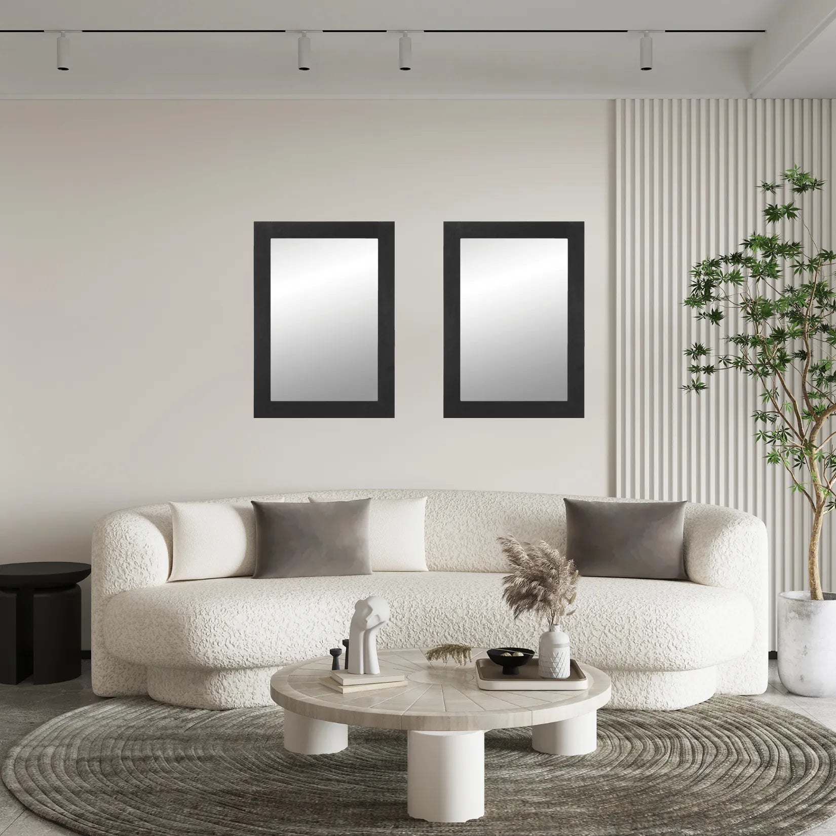 Deux miroirs rectangulaires noirs accrochés symétriquement dans un salon moderne.