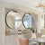 Deux miroirs ronds 80 cm dans une salle à manger élégante avec buffet et lustre doré.
